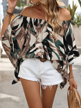 Blusa holgada con hombros descubiertos, mangas murcielago y estampado completo