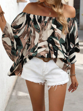 Blusa holgada con hombros descubiertos, mangas murcielago y estampado completo