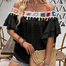 Blusa de hombros descubiertos con borlas en el borde
