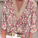Blusa de mujer con mangas 3/4 de estampado floral completo y remiendo de flor con cuello en V