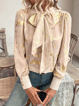 Blusa con lazo en el cuello y estampado grafico