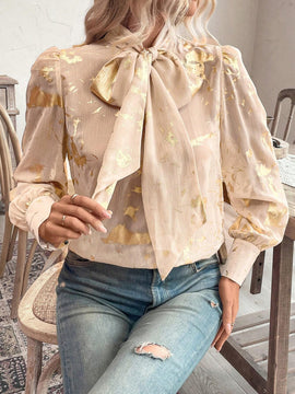Blusa con lazo en el cuello y estampado grafico