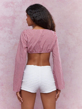 MISSGUIDED Parte superior corta a cuadros con frente abierto, detalles de corbata y mangas largas acampanadas