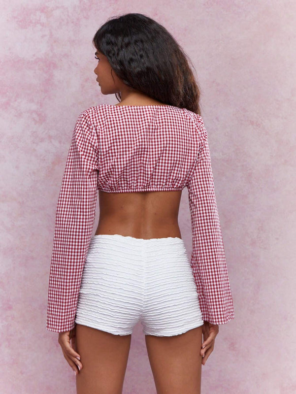 MISSGUIDED Parte superior corta a cuadros con frente abierto, detalles de corbata y mangas largas acampanadas