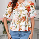 Blusa de cuello redondo con mangas gigot y textura de patron floral de tela