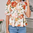 Blusa de cuello redondo con mangas gigot y textura de patron floral de tela