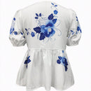Blusa de peplum con manga globo y nudo delantera con estampado floral