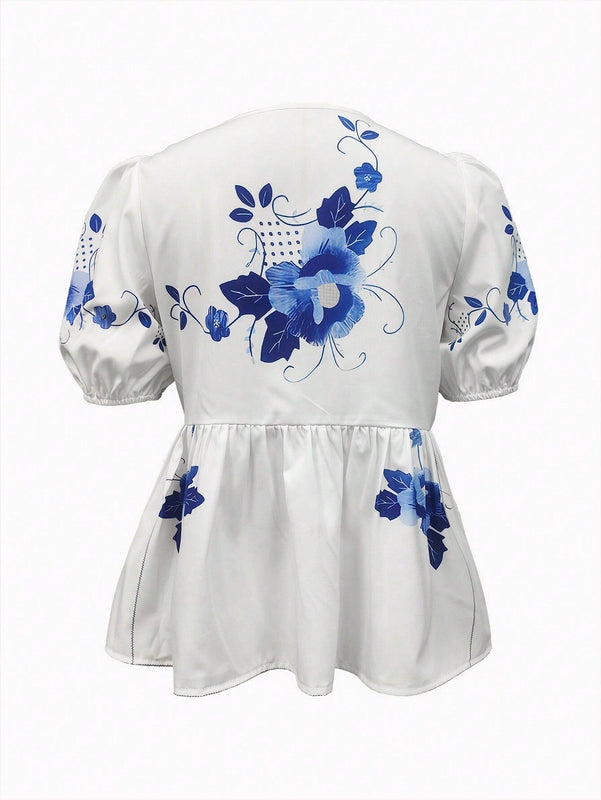 Blusa de peplum con manga globo y nudo delantera con estampado floral