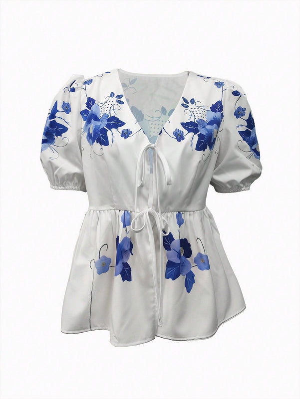 Blusa de peplum con manga globo y nudo delantera con estampado floral