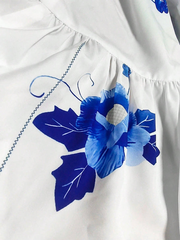 Blusa de peplum con manga globo y nudo delantera con estampado floral