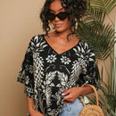 Camisa de mujer tejida con impresion, cuello en V, manga murcielago y estilo holgado regular para vacaciones