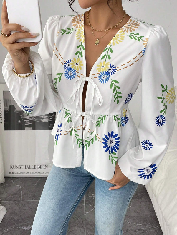Blusa blanca de manga larga impresa con volantes, lazo delantero y manga farol