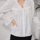 Top largo texturizado de manga larga para mujer con lazo frontal plisado de encaje, simple y casual, perfecto para vacaciones