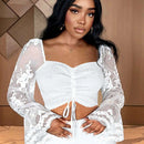 Blusa sexy de manga transparente con ribete de volantes