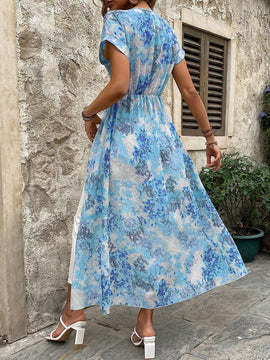 Camisa larga de manga corta y corte murcielago con cuello redondo y estampado floral para mujer con dobladillo dividido para vacaciones