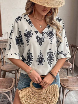 Camisa casual femenina con manga murcielago y cuello en V con estampado floral para vacaciones, patron aleatorio