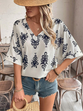 Camisa casual femenina con manga murcielago y cuello en V con estampado floral para vacaciones, patron aleatorio