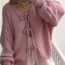 Frenchy cardigan de punto unicolor de color rosa palido con cinturon delantero, se puede usar sobre una camiseta