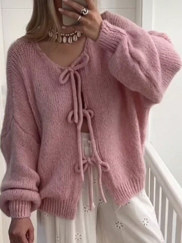Frenchy cardigan de punto unicolor de color rosa palido con cinturon delantero, se puede usar sobre una camiseta