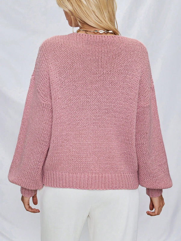 Frenchy cardigan de punto unicolor de color rosa palido con cinturon delantero, se puede usar sobre una camiseta