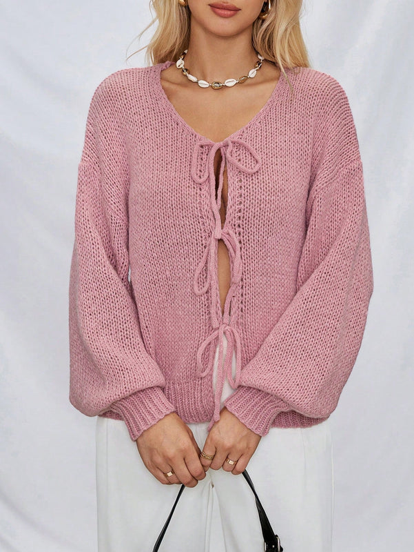 Frenchy cardigan de punto unicolor de color rosa palido con cinturon delantero, se puede usar sobre una camiseta