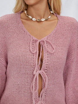 Frenchy cardigan de punto unicolor de color rosa palido con cinturon delantero, se puede usar sobre una camiseta