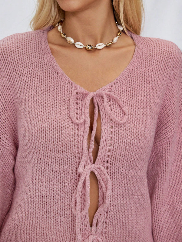 Frenchy cardigan de punto unicolor de color rosa palido con cinturon delantero, se puede usar sobre una camiseta