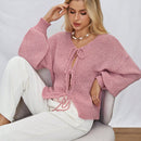Frenchy cardigan de punto unicolor de color rosa palido con cinturon delantero, se puede usar sobre una camiseta