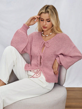 Frenchy cardigan de punto unicolor de color rosa palido con cinturon delantero, se puede usar sobre una camiseta