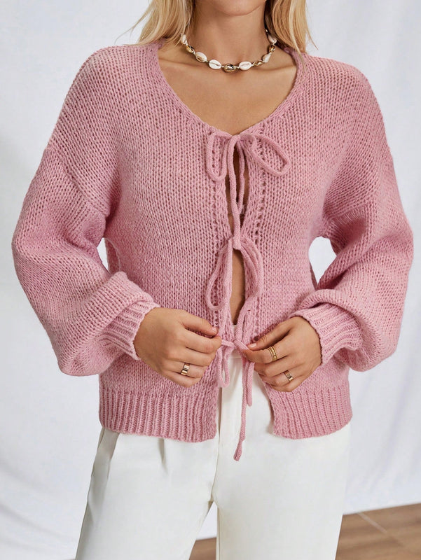 Frenchy cardigan de punto unicolor de color rosa palido con cinturon delantero, se puede usar sobre una camiseta