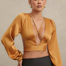Blusa de cuello en V profundo y lazo trasero