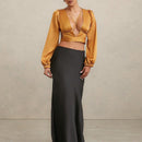 Blusa de cuello en V profundo y lazo trasero