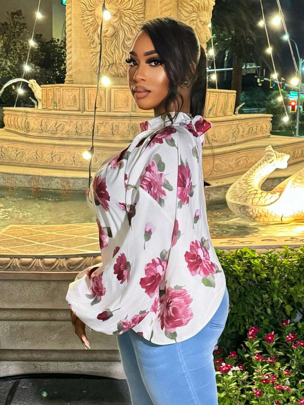 Blusa de manga larga con cuello alto y estampado floral para mujer