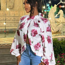 Blusa de manga larga con cuello alto y estampado floral para mujer