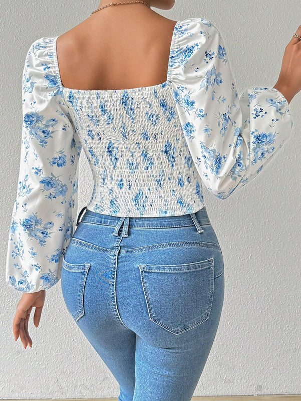 Blusa con estampado floral, manga de linterna y nudo delantero