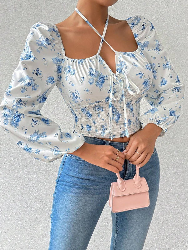 Blusa con estampado floral, manga de linterna y nudo delantero