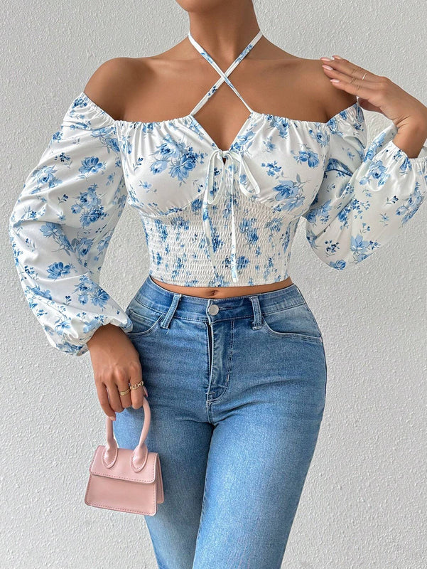 Blusa con estampado floral, manga de linterna y nudo delantero