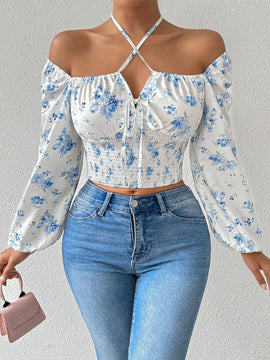 Blusa con estampado floral, manga de linterna y nudo delantero