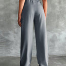 Pantalones altos de pierna ancha con pliegues
