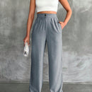 Pantalones altos de pierna ancha con pliegues