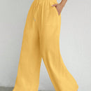 Pantalones sueltos de pierna ancha de color solido para mujer con dobladillo fluido, estilo casual