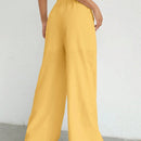 Pantalones sueltos de pierna ancha de color solido para mujer con dobladillo fluido, estilo casual