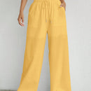 Pantalones sueltos de pierna ancha de color solido para mujer con dobladillo fluido, estilo casual