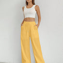 Pantalones sueltos de pierna ancha de color solido para mujer con dobladillo fluido, estilo casual