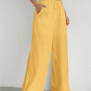 Pantalones sueltos de pierna ancha de color solido para mujer con dobladillo fluido, estilo casual