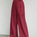 Pantalones sueltos de pierna ancha de color solido para mujer con dobladillo fluido, estilo casual