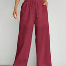 Pantalones sueltos de pierna ancha de color solido para mujer con dobladillo fluido, estilo casual