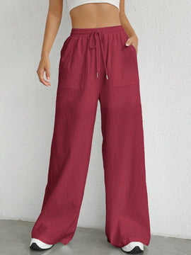 Pantalones sueltos de pierna ancha de color solido para mujer con dobladillo fluido, estilo casual