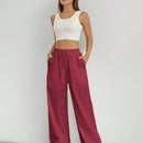 Pantalones sueltos de pierna ancha de color solido para mujer con dobladillo fluido, estilo casual