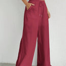 Pantalones sueltos de pierna ancha de color solido para mujer con dobladillo fluido, estilo casual